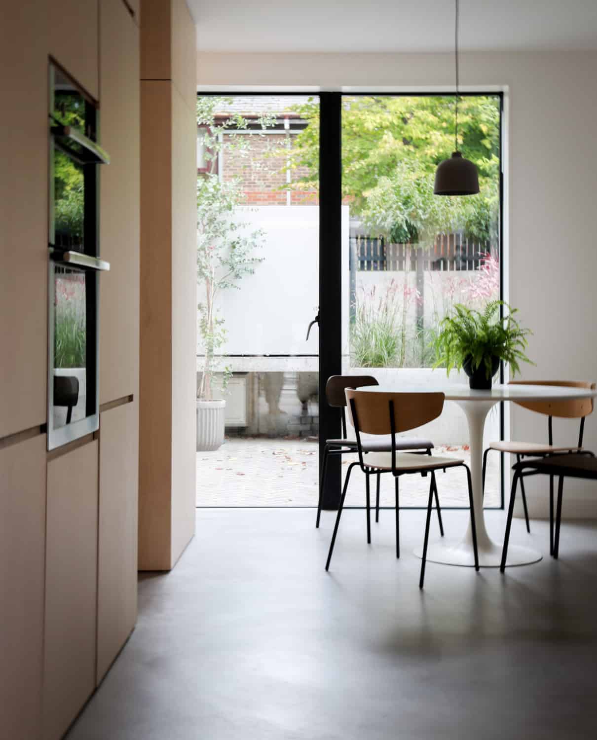 Modern dining area with Ideal Work Microtopping flooring