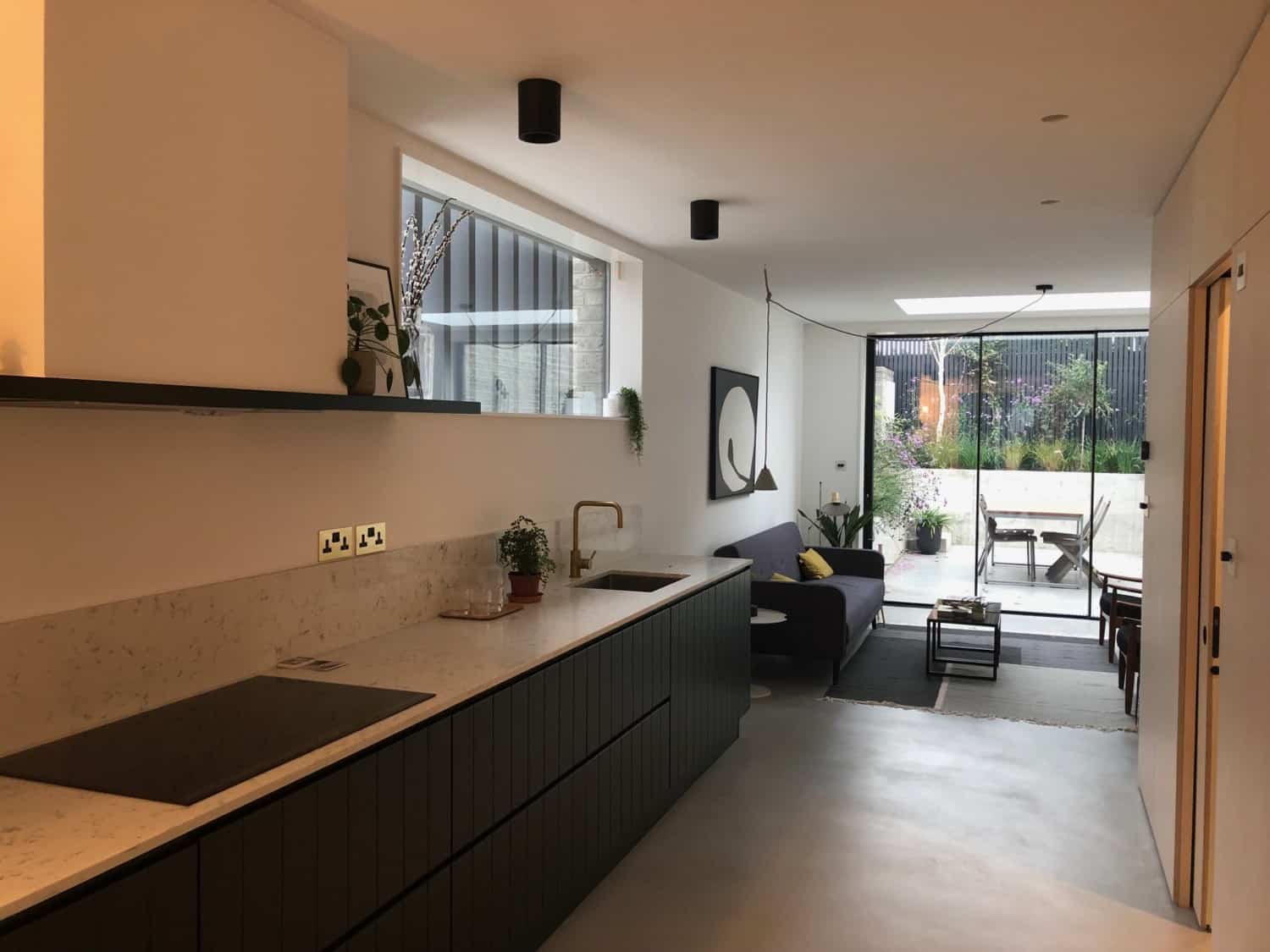 Kitchen with grey cabinets and microtopping floor