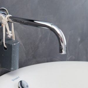 Polished concrete wall in bathroom