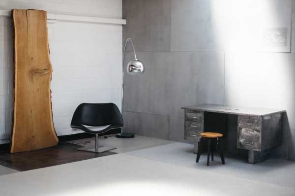 Image of polished concrete showroom., containing a desk roomset.